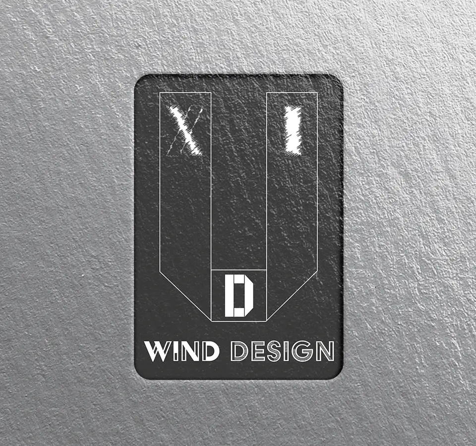 Traduction visuelle de la vision du métier de designer UX-UI par WINDELS Loïck.
On voit les lettres X et I gravées à l'intérieure de la lettre U.
Le nom WIND DESIGN est celui de la société.